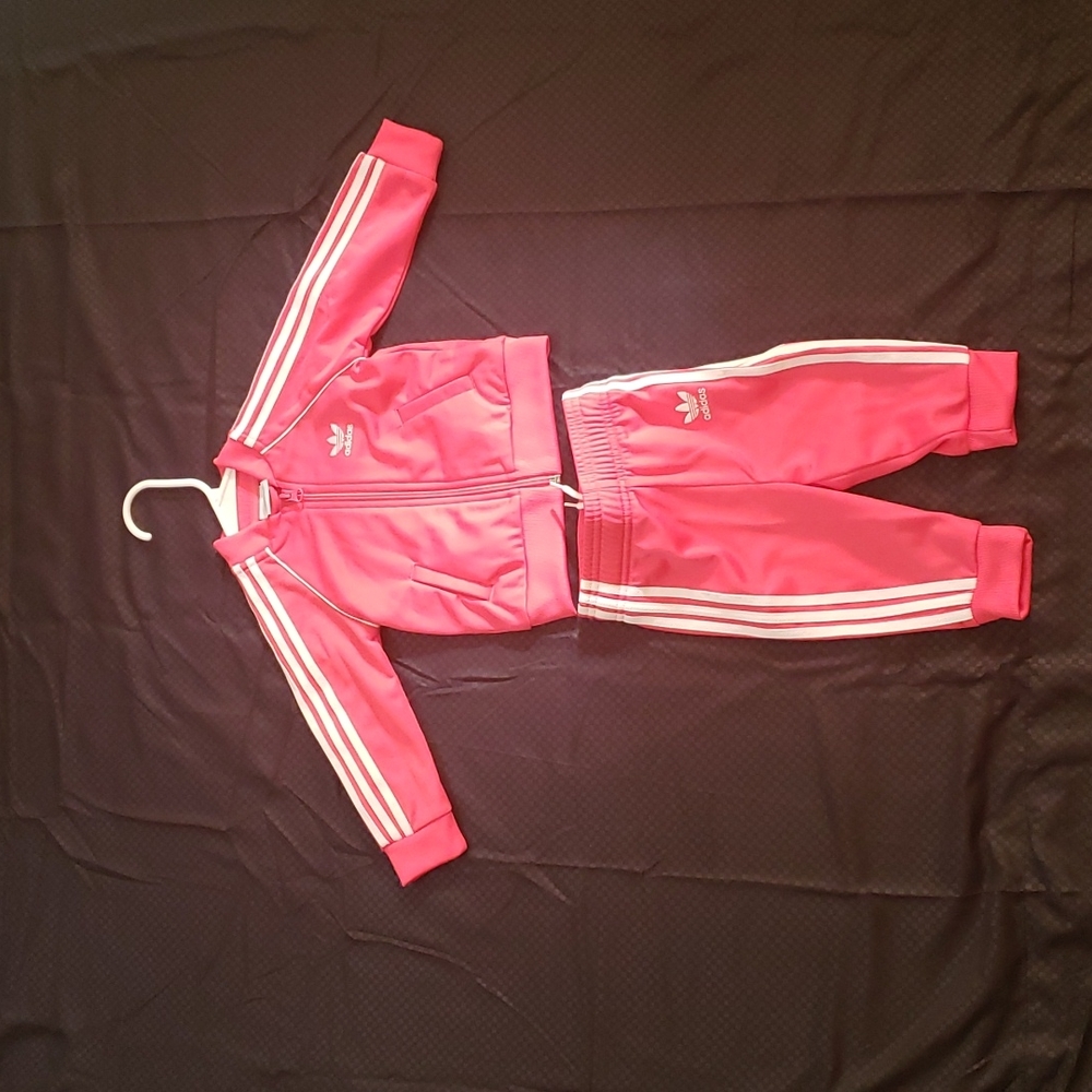 Pink and white Adidas